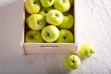 Healthy green apples in wooden box. Fruit from farmer.