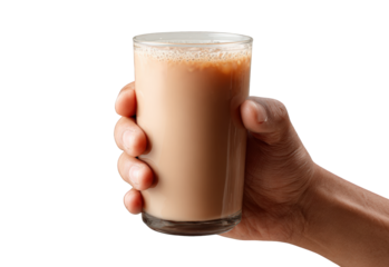 Hand holding a glass of light brown beverage (1)