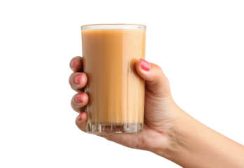 Hand holding a glass of light brown beverage (2)