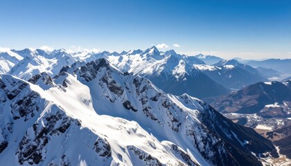 Obraz premium Snow-Covered Mountains Under Clear Blue Sky