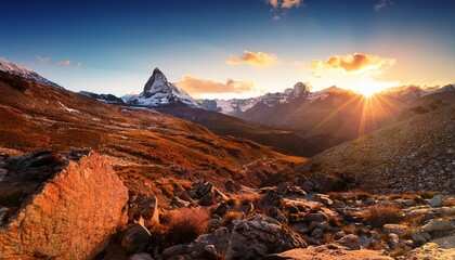 Fototapeta premium a breathtaking mountainous landscape at sunset dominating the scene is a majestic snow capped peak which stands as the tallest mountain in the image