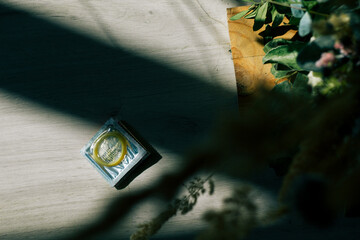 condom in a package in the interior of a living room in a residential building. concept: unwanted...