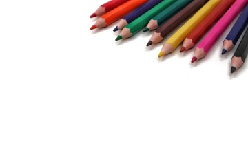 A vivid spread of colorful pencils extending diagonally from the top right corner at a 45-degree angle, creating an energetic and artistic composition.