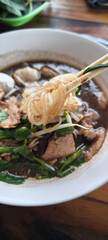Pork waterfall noodles in a white plate