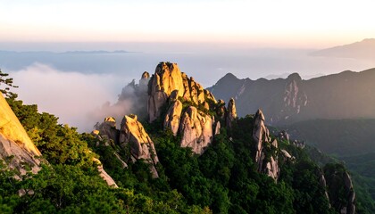 Mountain peaks bathed in sunrise mist