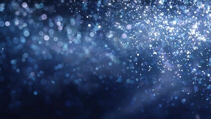 Fototapeta premium Abstract, dark blue background with sparkling, light blue particles