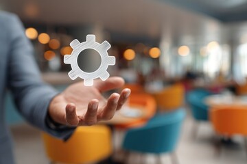 A hand hovers over a digital gear icon in a cafe setting
