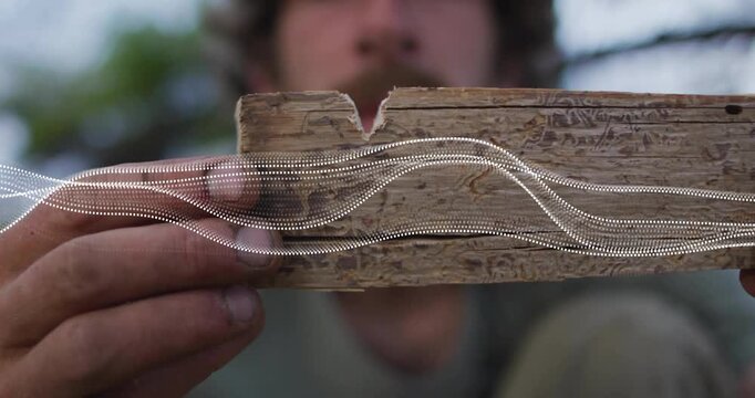 Craftsman positioning plank in technology demo activating animated waveforms mapping V-shaped notch
