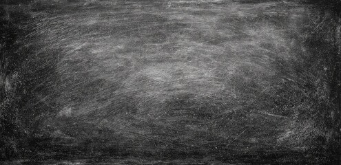 Textured grayscale surface with various marks and smudges