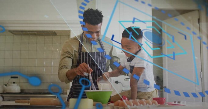 Father and son positioning green mixing bowl, pouring milk and whisking batter for cooking tutorial