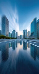 Urban cityscape reflected in wet road, motion blur