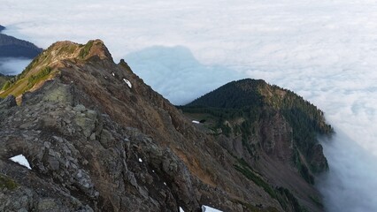 Mount Chim rises from the clouds. View from above.