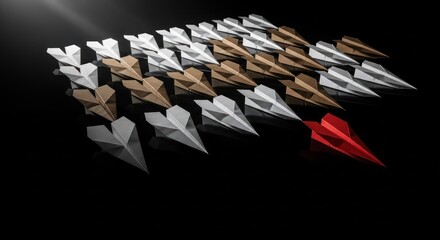 Red paper airplane leads a formation of white and tan ones