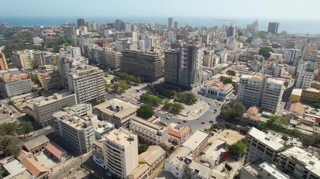 SENEGAL - 7.14.2025 - Terrific aerial footage moving over a traffic circle in Dakar, Senegal.
