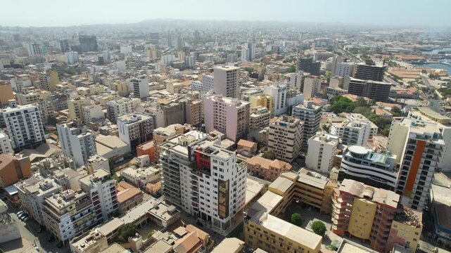 SENEGAL - 7.14.2025 - Great aerial footage moving over buildings of the densely packed city of Dakar, Senegal.