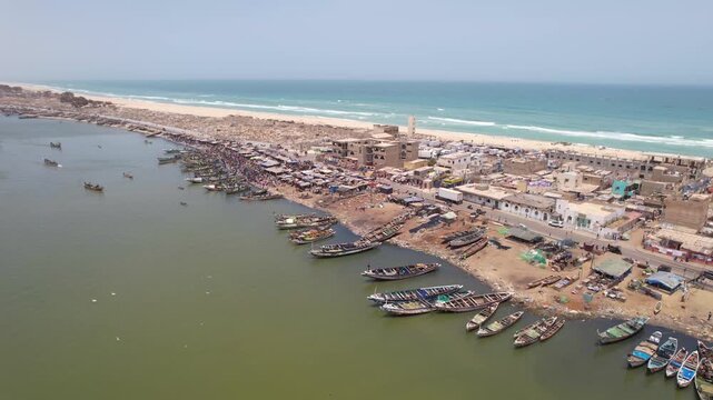 SENEGAL - 7.16.2025 - Very good distant aerial view of a busy harbor on Senegal's Island of Saint-Louis.