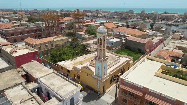 SENEGAL - 7.16.2025 - Excellent aerial footage circling a mosque on the banks of the Senegal River.