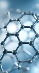 Close-up of a 3D molecular structure, likely graphene, with metallic spheres and connecting rods