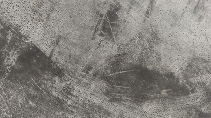 Grunge concrete wall texture with scratches, stains, and natural imperfections. High-resolution background for industrial design, architecture, or abstract creative projects.