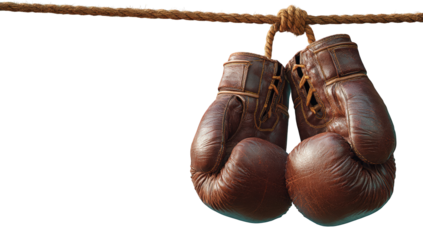 Vintage boxing gloves hanging from a rope