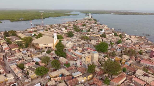 SENEGAL - 7.31.2025 - Excellent aerial footage circling a mosque on the island of Joal-Fadiouth, Senegal.