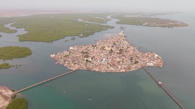 SENEGAL - 7.31.2025 - Incredible aerial footage starting to circle counterclockwise around the island of Joal-Fadiouth, Senegal.