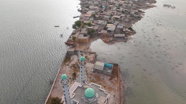 SENEGAL - 7.31.2025 - Terrific aerial footage passing over the entire the island of Joal-Fadiouth, Senegal.