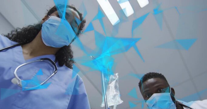 Scrub nurse entering triggers medical team adjusting IV drip, analyzing triangles for accuracy