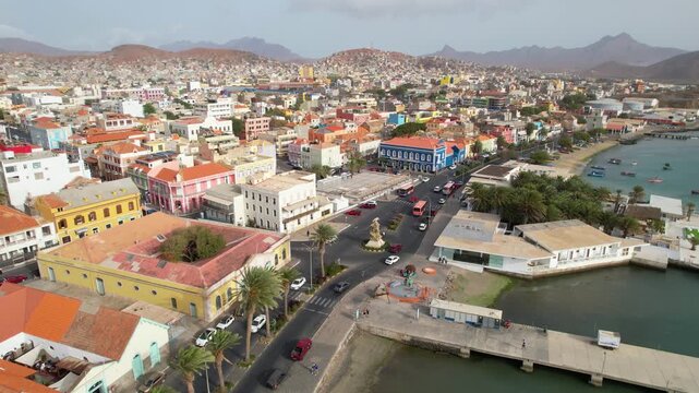 CAPE VERDE - 8.4.2025 - Beautiful aerial footage moving along cars as they drive up a port of Mindelo, Cape Verde.
