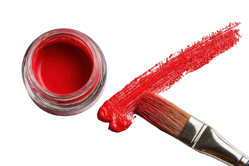 Red paint in a jar and a paintbrush
