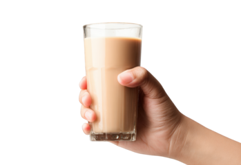 Hand holding a glass of light brown drink (1)