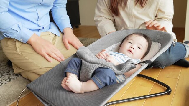 Couple soothing a baby in a room