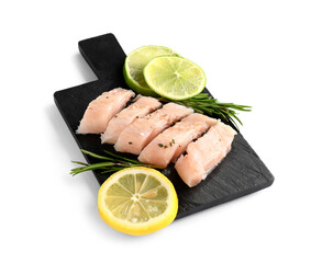 Slate board with pieces of codfish fillet on white background