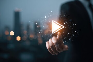 Hand interacting with a glowing play button over a city backdrop