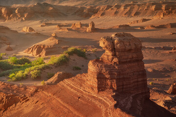 Stunning Desert Landscape with Rock Formations and Green Flora Oasis