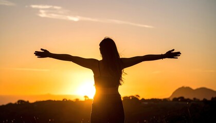 Fototapeta premium Woman Embracing Sunset Silhouette of Freedom and Joy