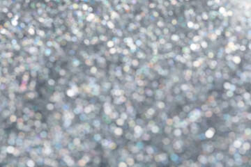 Blurred shiny silver glitter as background, closeup