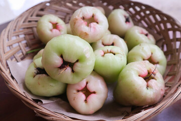 Fresh Green Rose Apples in Rustic Basket