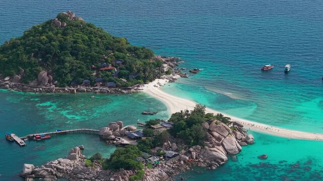 Koh Nang Yuan, Koh Tao island Thailand Aerial drone push in. Beach, mountain and jungle, sand blue turquoise water.