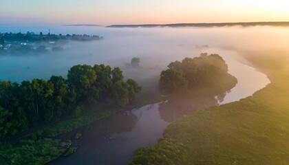 Misty river valley at sunrise