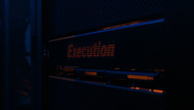 Futuristic server rack closeup with blinking lights and cables in a dark data center environment