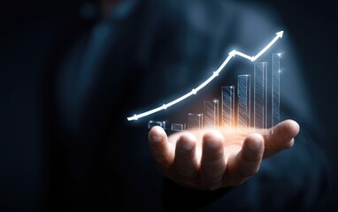Business hand holding a glowing upward graph