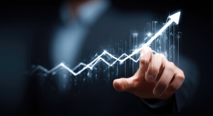 Hand pointing at a glowing upward trend graph (2)