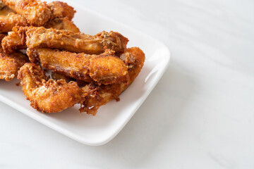 Fried Snapper Belly on white plate