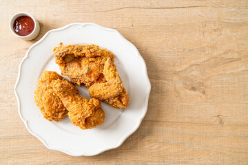 fried chicken with ketchup on plate