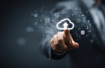 Businessman's finger touches a cloud-upload icon, surrounded by digital data