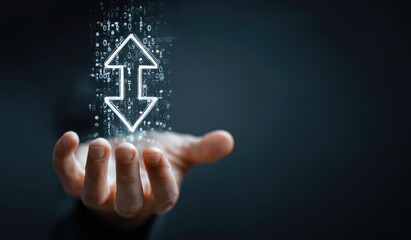 Hand holds a digital up and down arrow, data particles floating around it