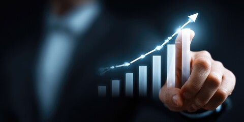Businessperson points to a projected upward trend graph