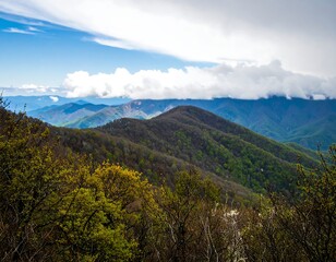Fototapeta premium Mountain vista with layered hills and clouds