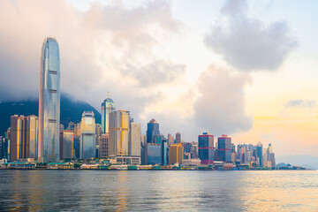 Fototapeta premium Hong Kong cityscape skyline at sunrise sky across Victoria harbor. One of the most tourist attaction in Hong Kong Island, China.